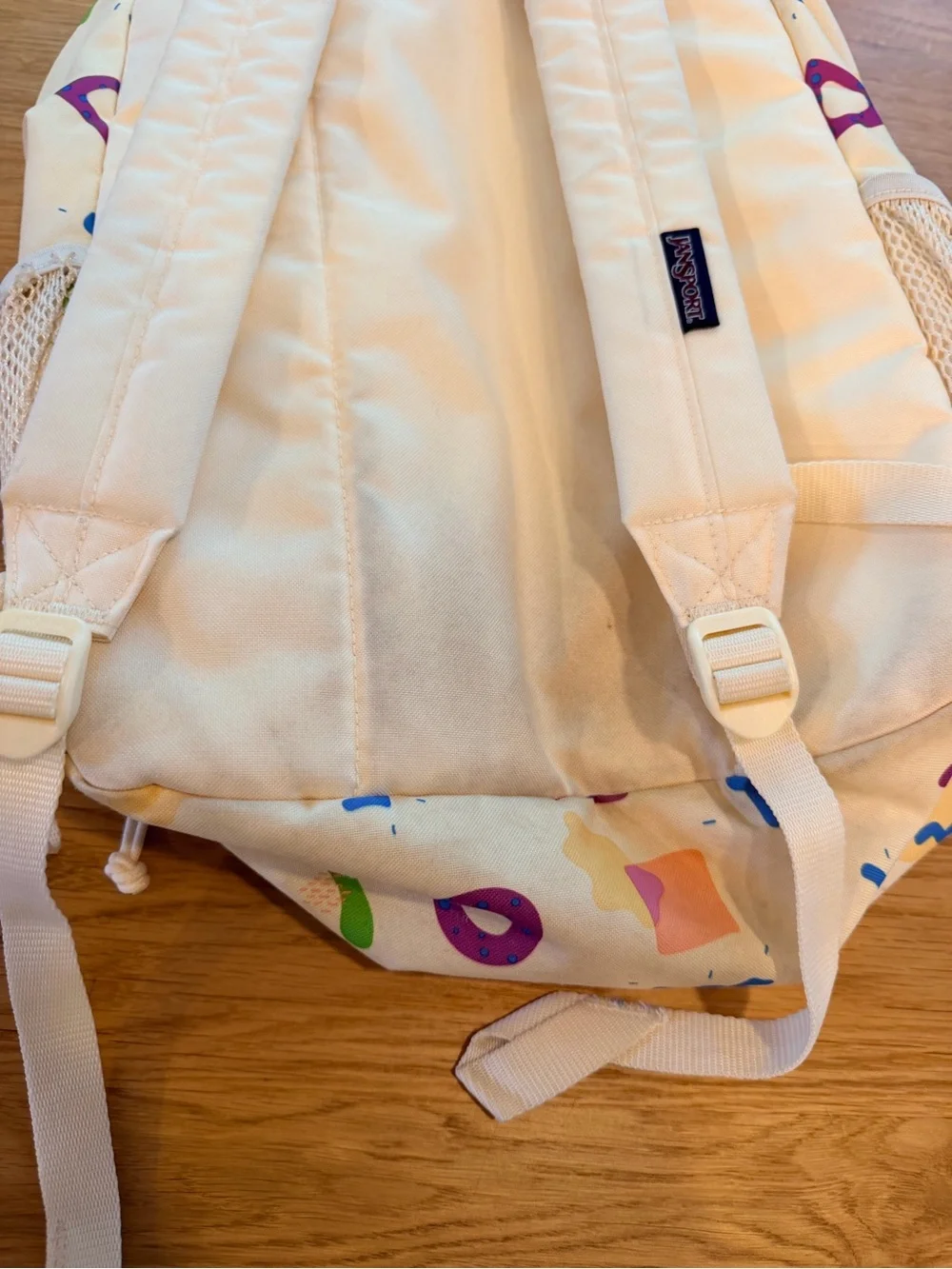 Jansport Cream Backpack with Pastel Pink, Purple & Green Shapes